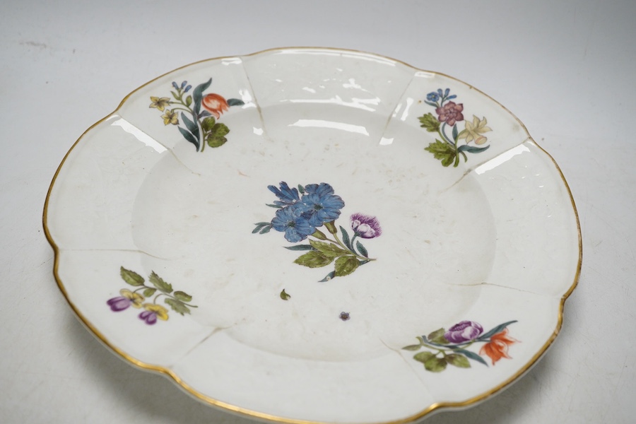 Three porcelain plates comprising an 18th century Meissen floral example and two Sevres, together with an 18th century polychrome tin glazed, largest 25cm in diameter. Condition - fair